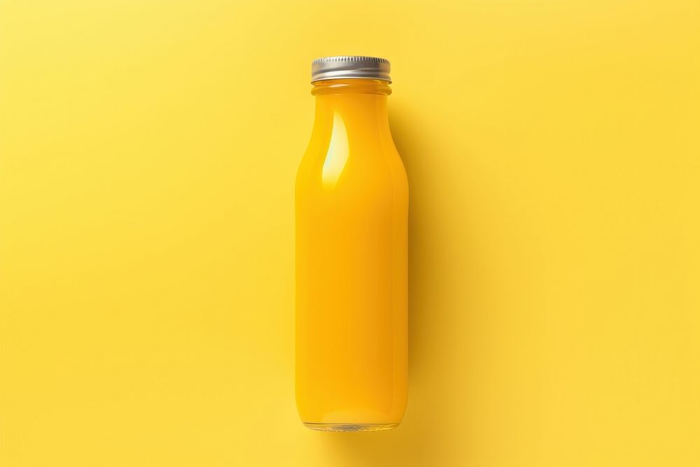 Bottle of clod pressed juice yellow refreshment container.