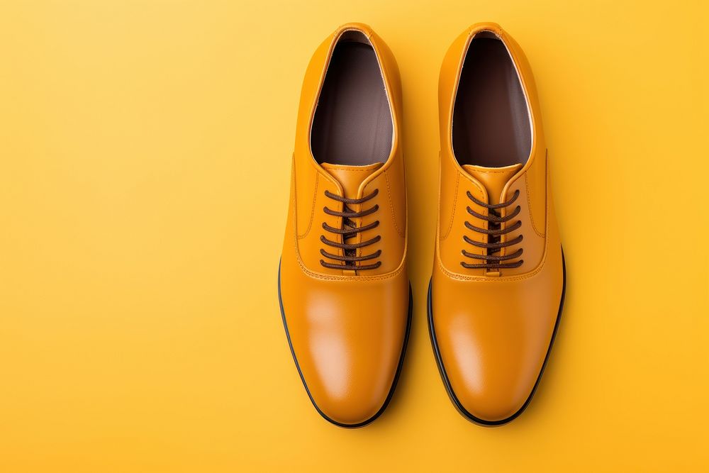 Brown leather oxford shoes footwear yellow shoelace.