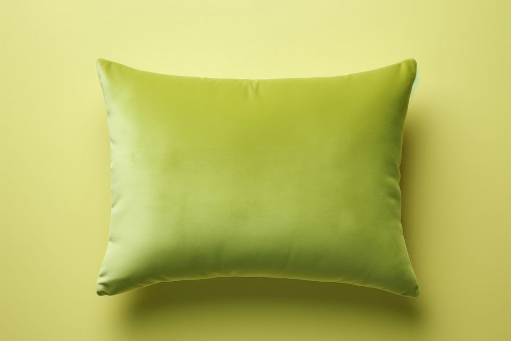 Green velvet cushion pillow backgrounds yellow accessories.