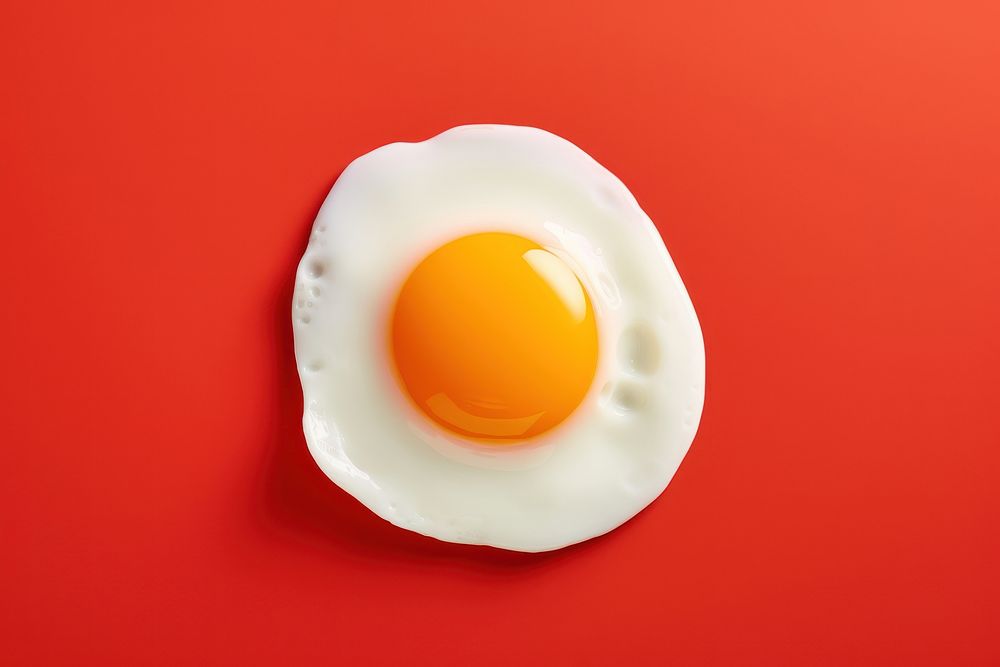Sunny side up egg food red yellow.