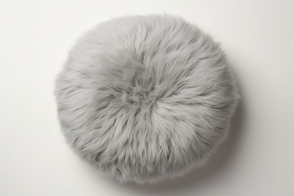 Fluffly round cushion pillow fur softness clothing.