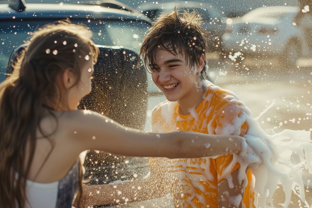 Carefree teenagers organize charity car wash carefree transportation togetherness.