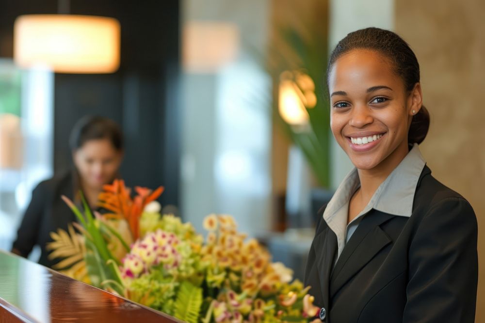 Receptionist and businesswoman at hotel flower adult happy.