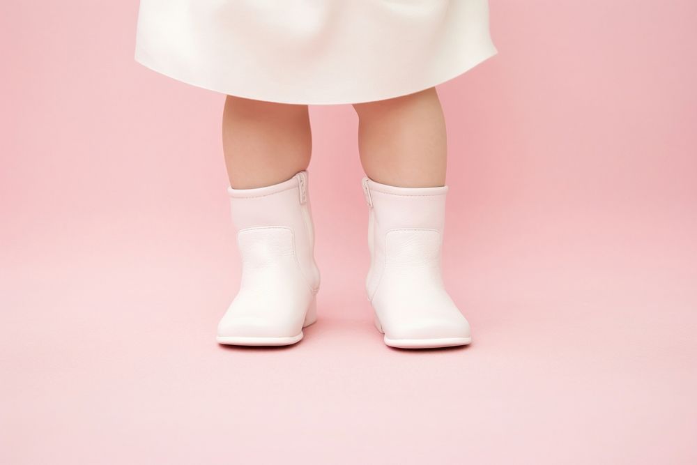 Infant in blank white booties footwear shoe sock.