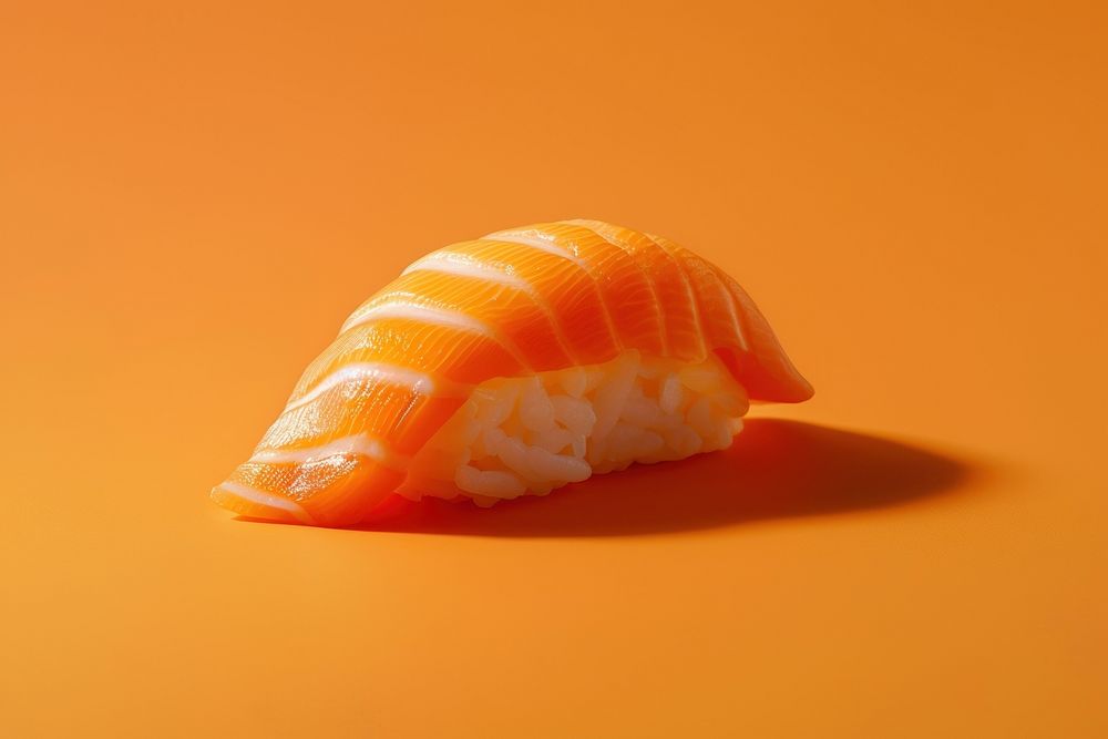 1 bite Nigiri sushi with salmon animal food invertebrate.