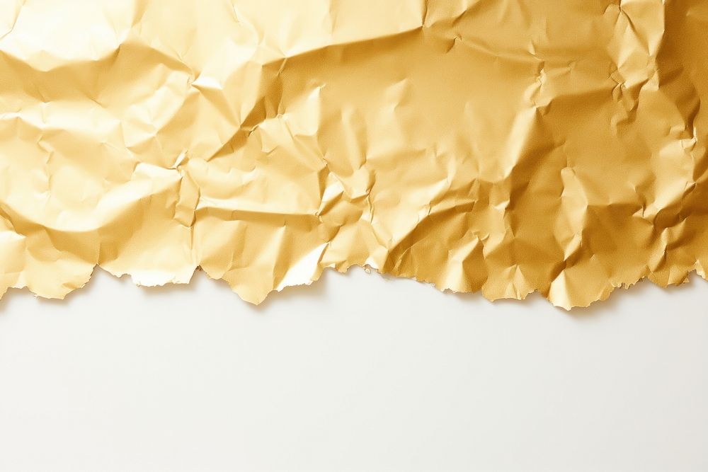 Gold foil paper backgrounds torn white background.