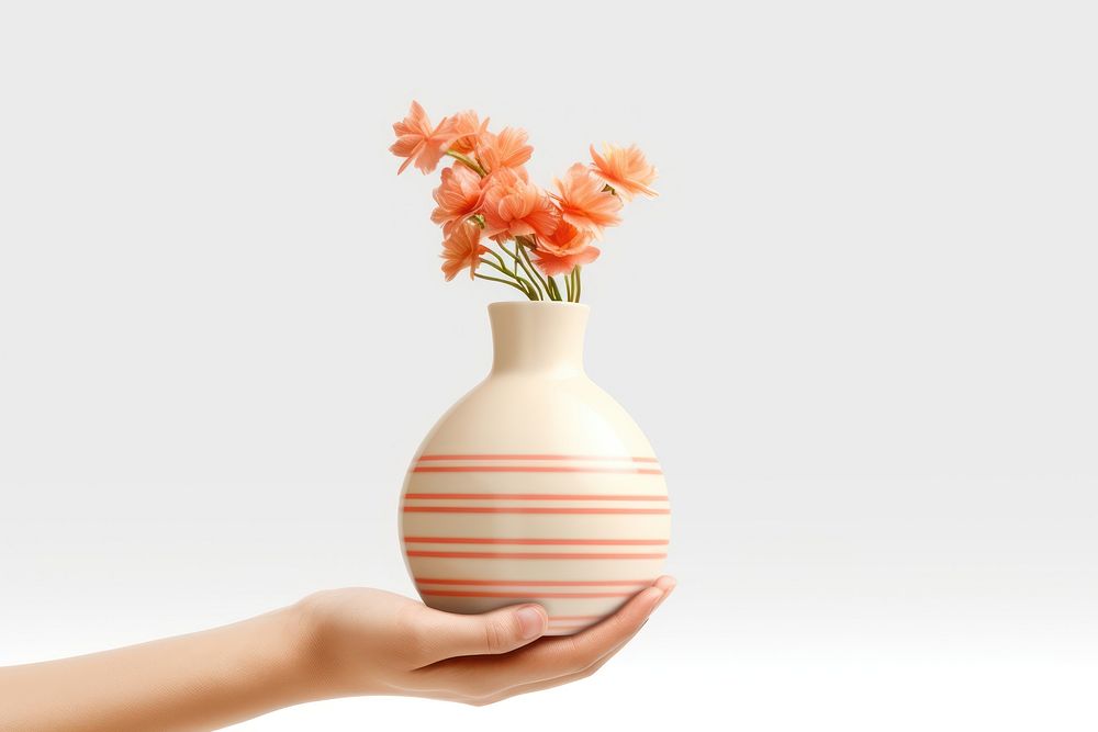 Hand holding a vase pottery flower adult.