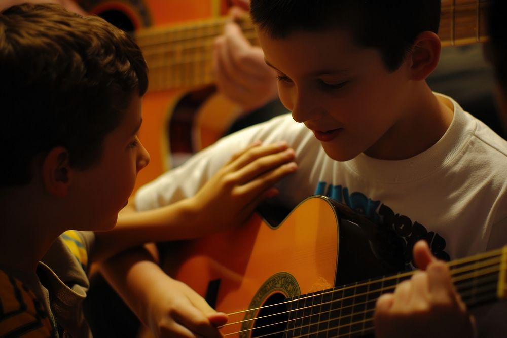 Teaching a guitar musician person finger.