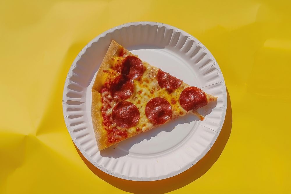 Pizza plate yellow slice.