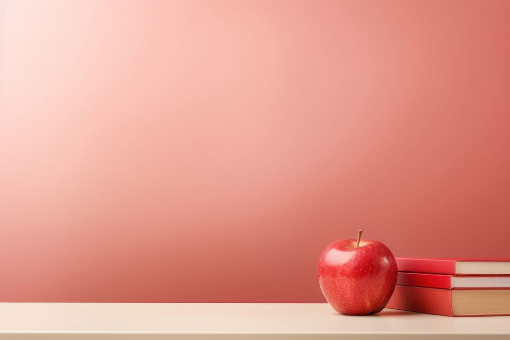 Education light red background apple fruit intelligence.