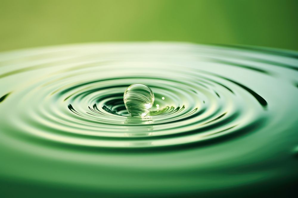 Green ripple water drop.