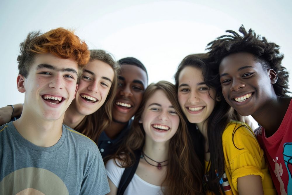 Multiracial group of young people standing in front laughing selfie youth.