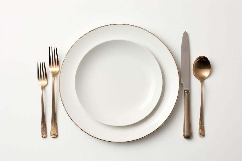 Empty plates and cutlery on the side knife spoon white.