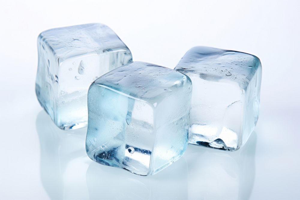 Three ice cubes freezing beverage jewelry.