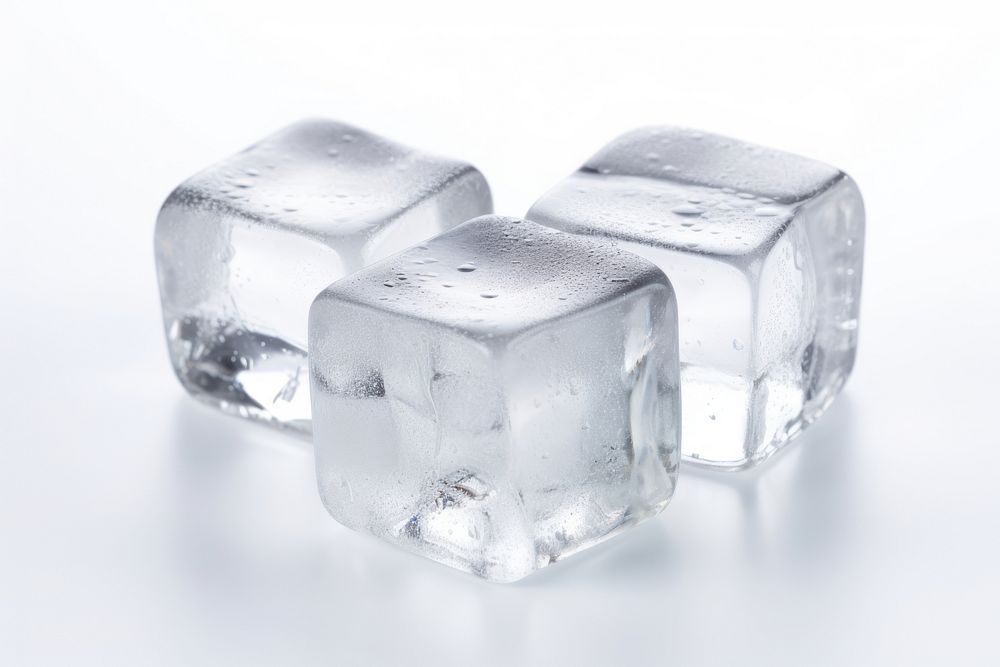 Three ice cubes crystal white background freezing.