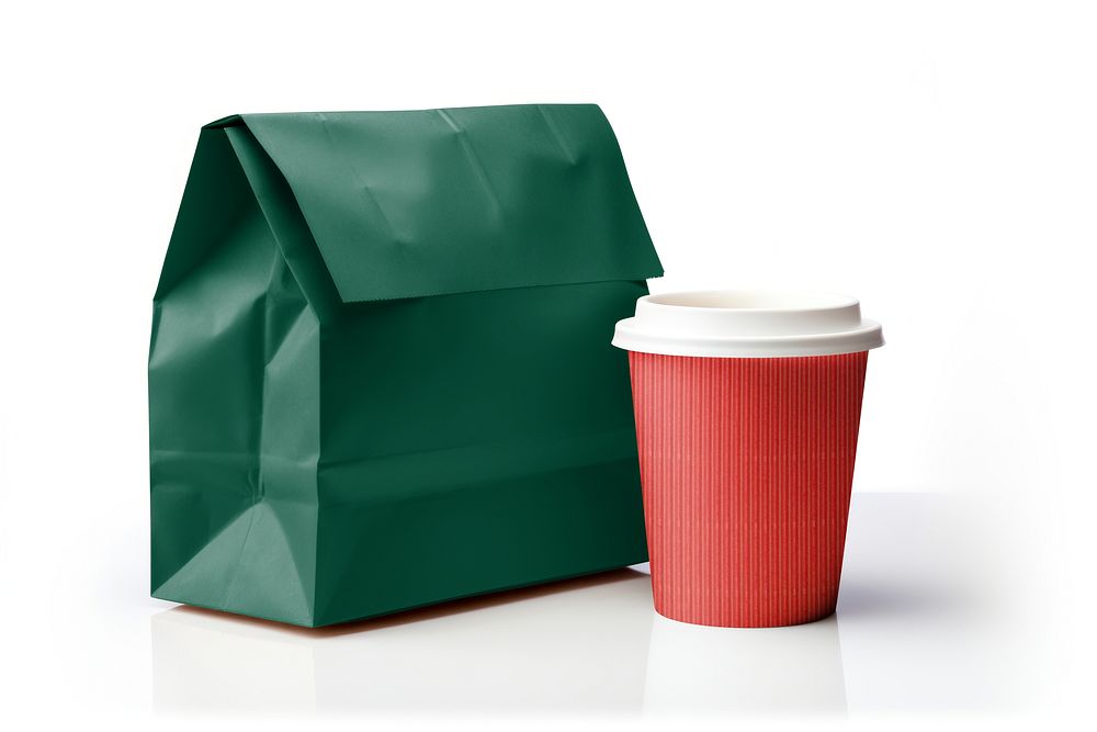 Red disposable coffee cup and green paper bag