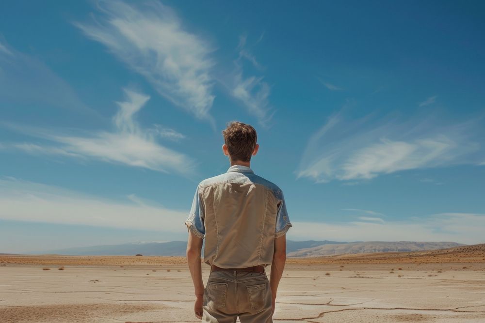 Man standing at desert sky outdoors horizon.