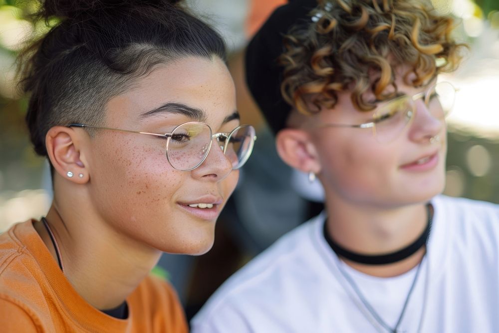 Two diversity cool teens interacting with friends photography portrait glasses.