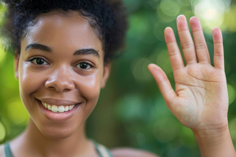 Happy black female waving smile skin gesturing.