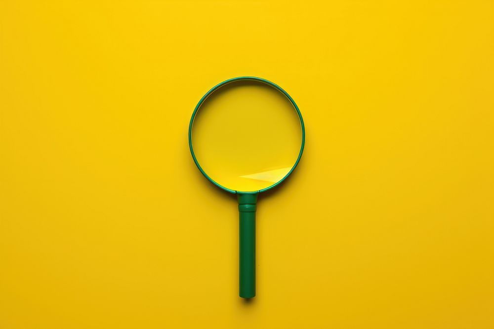 Magnifying glass backgrounds yellow reflection.