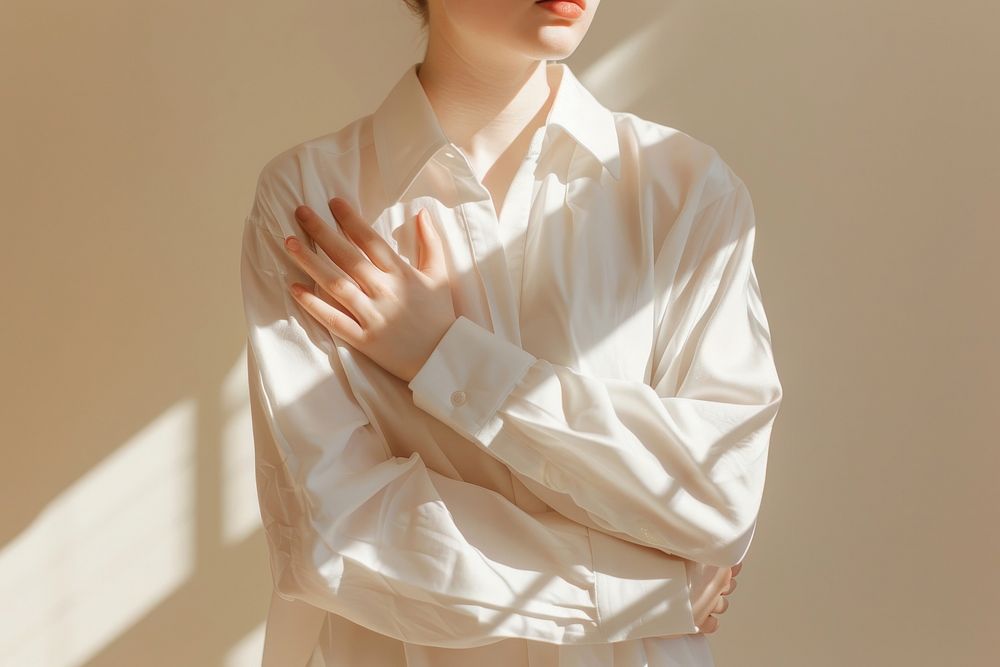 White shirt sleeve blouse contemplation.
