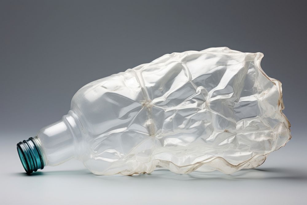 White plastic crumpled bottle refreshment drinkware container.
