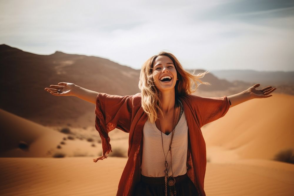 Woman standing at desert laughing adult happy.