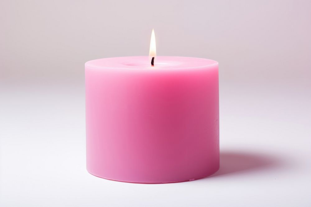 Pink candle lighting cylinder glowing.
