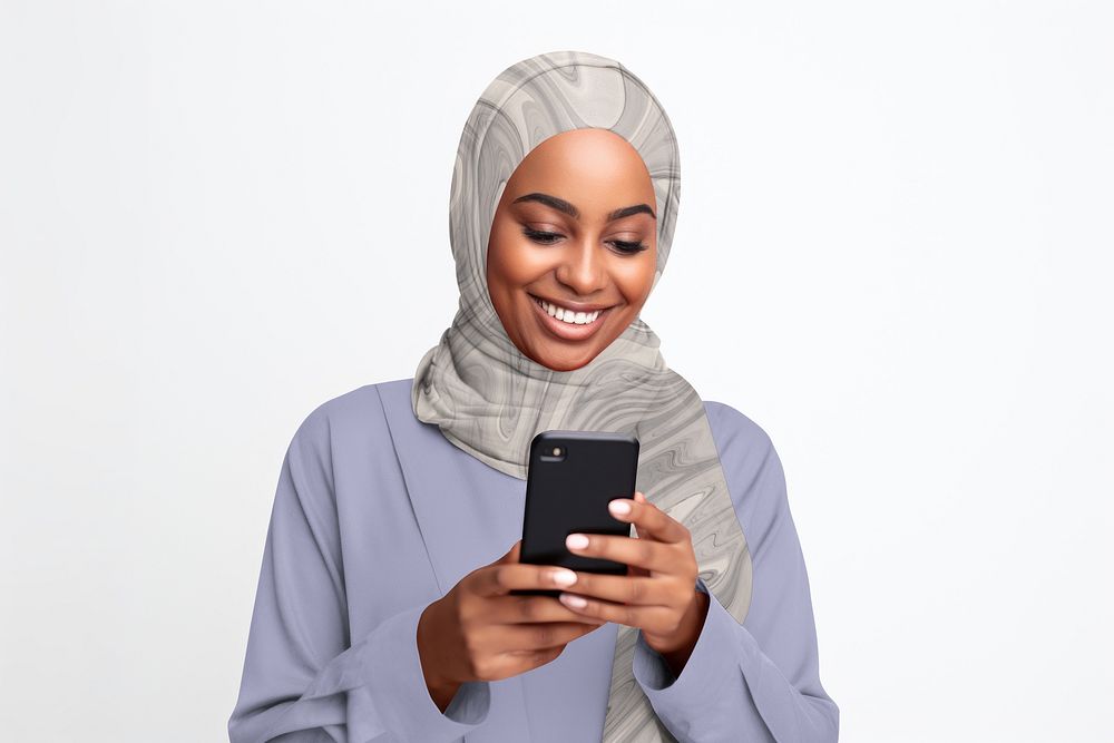 Happy Muslim woman using a phone