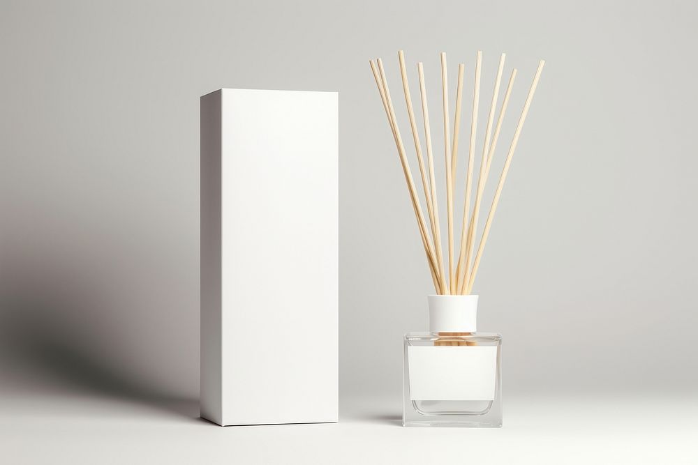 Reed Diffuser with Box packaging Mockup cosmetics perfume bottle.