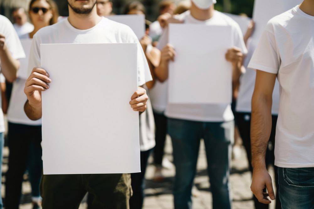 Volunteering wearing blank white protest t-shirt people.