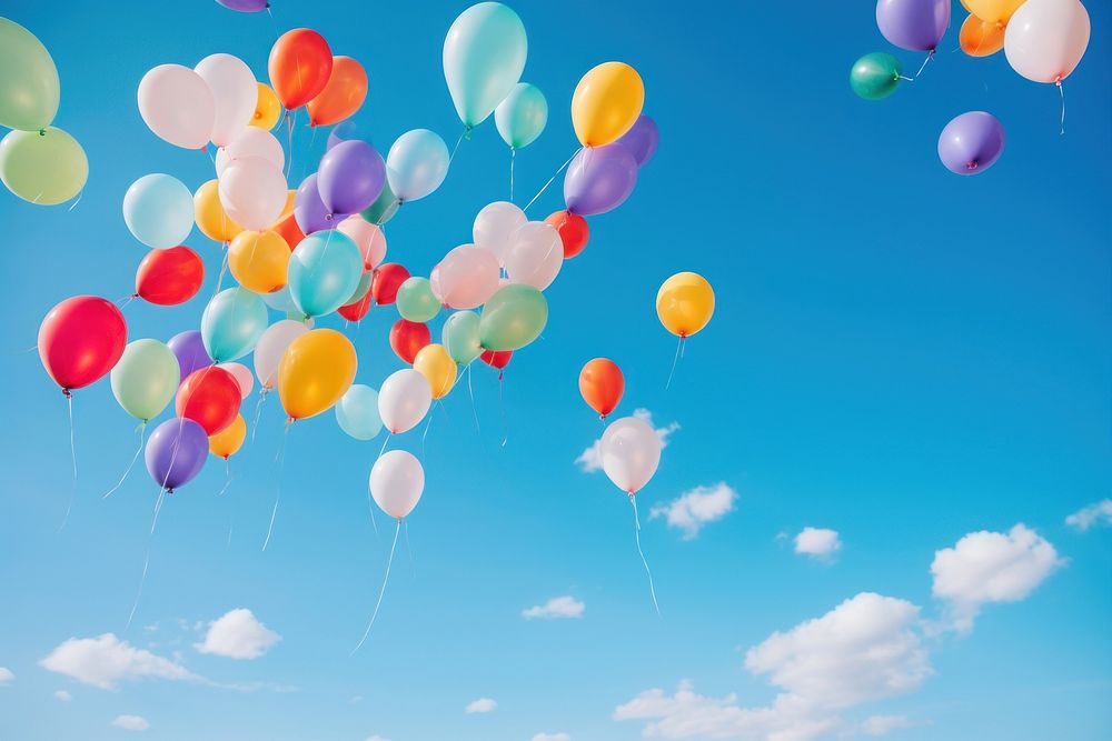 Balloons floating in the sky backgrounds blue tranquility.