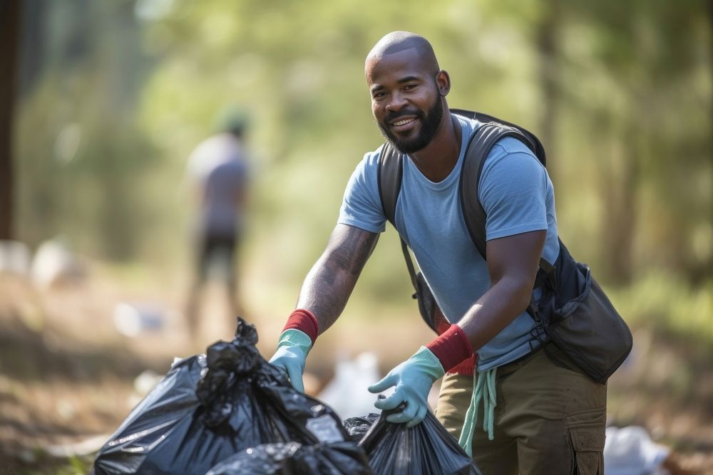 African american man volunteering cleaning garbage adult.