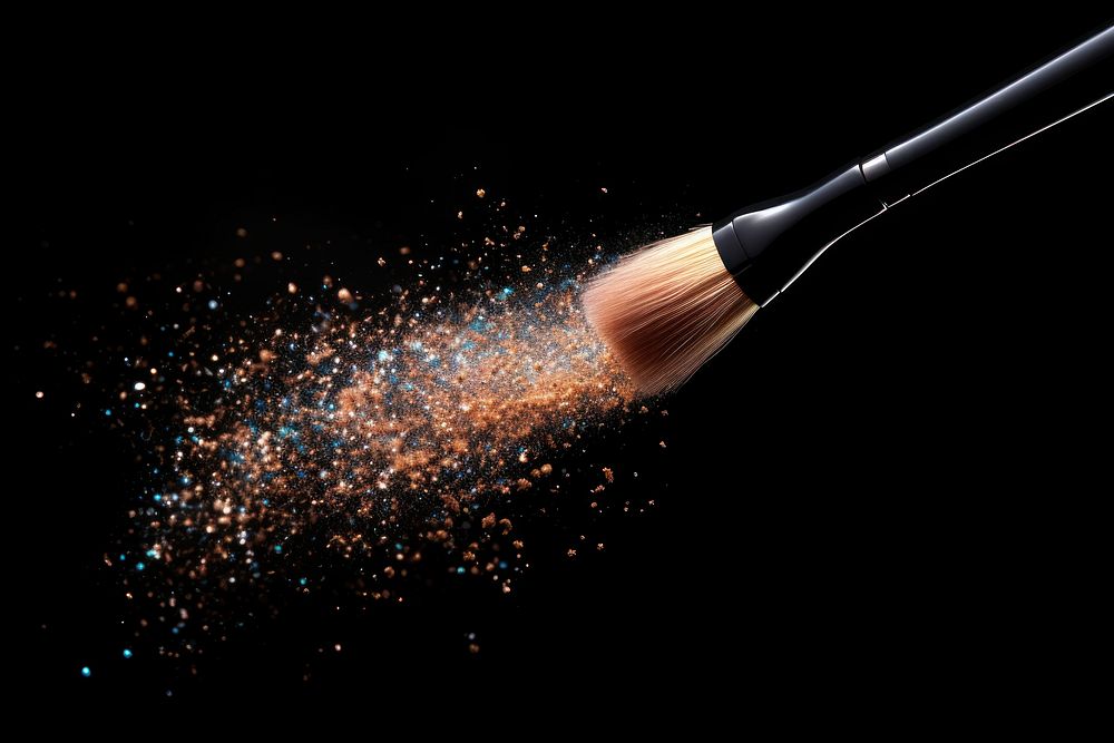Makeup brush cosmetics black background fireworks.