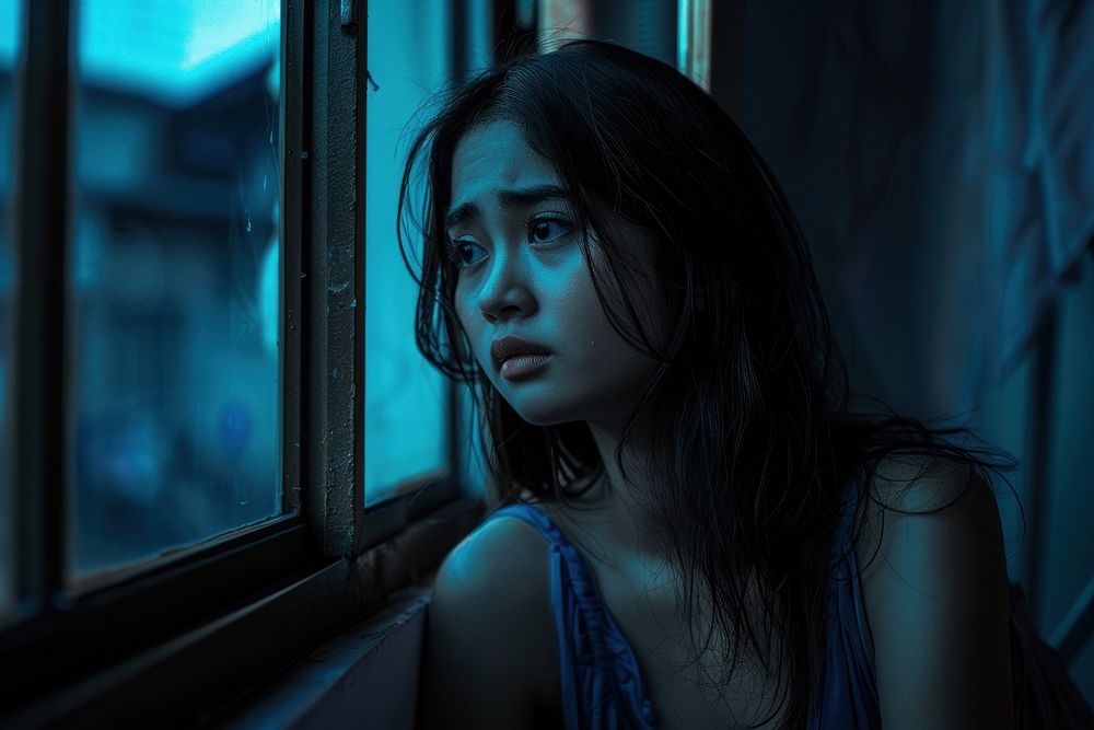 Thai woman in movie portrait worried night.