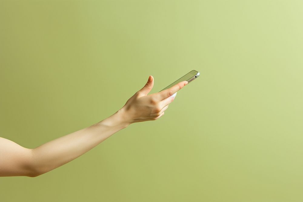 Hand holding phone adult electronics technology.