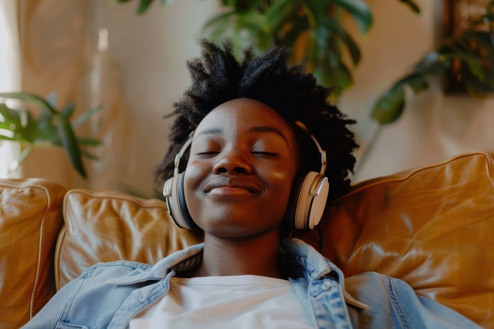 Black woman headphones hair electronics.