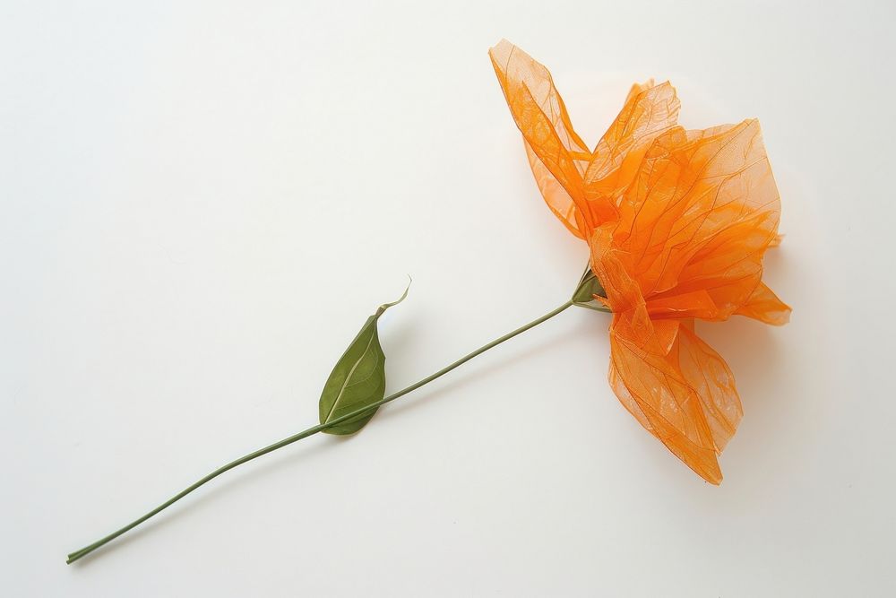 Orange flower made from plastic blossom anemone plant.