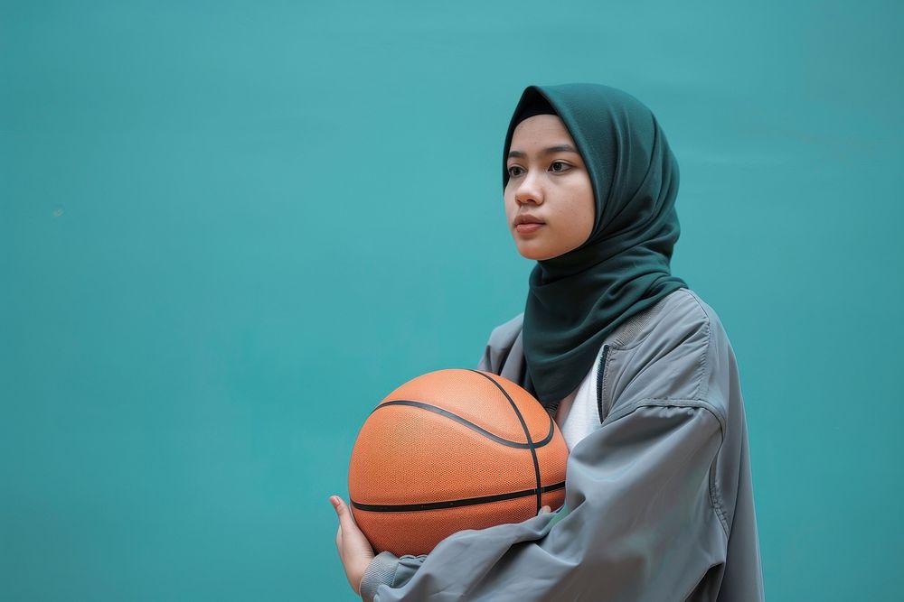 Indonesian woman holding basketball clothing apparel sports.