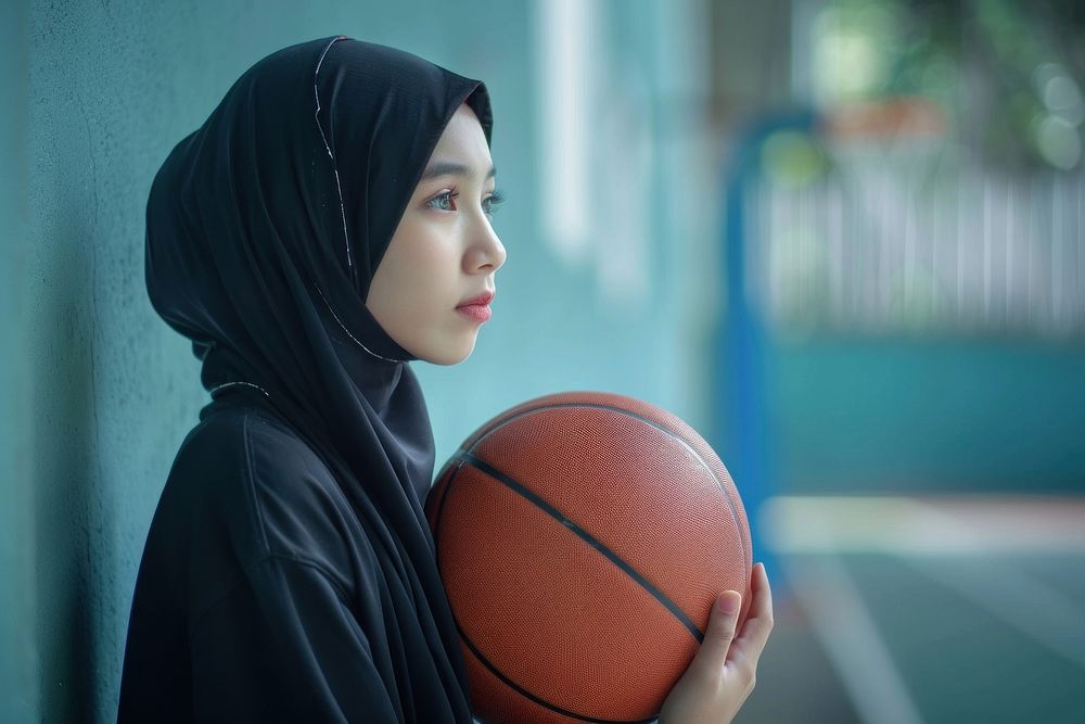 Indonesian woman holding basketball sports female person.