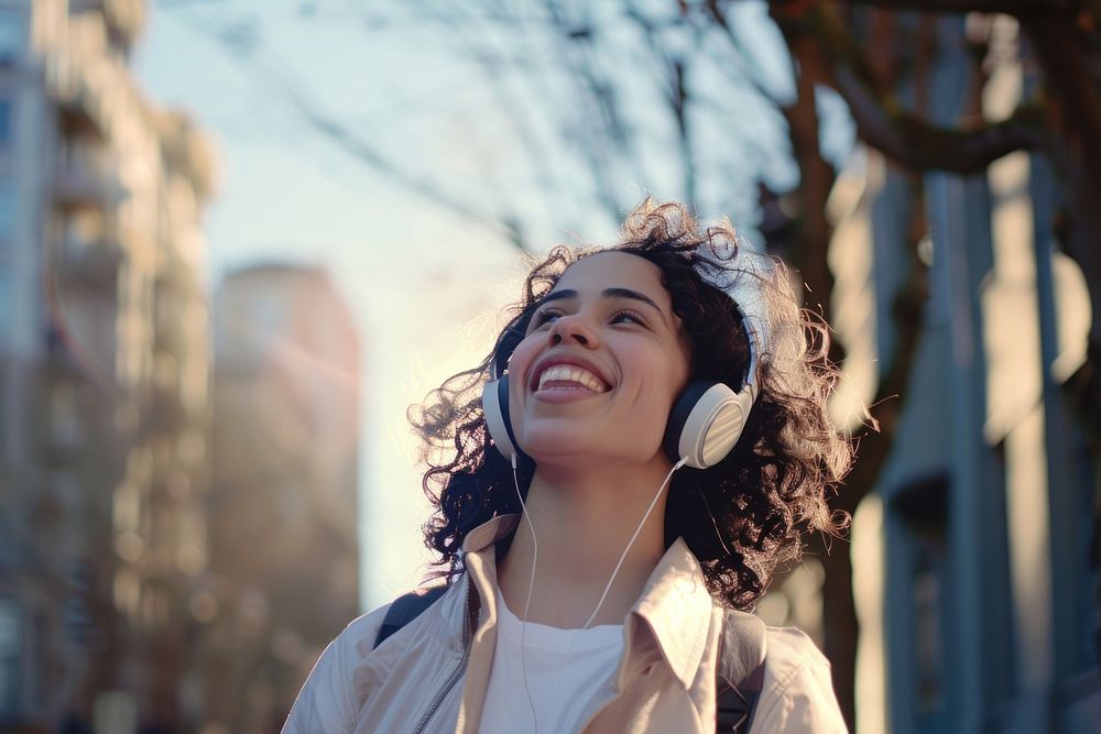 Hispanic woman headphones happy face.