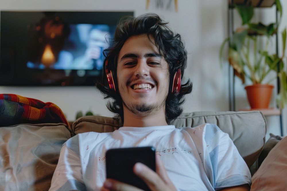 Hispanic male happy smile electronics.