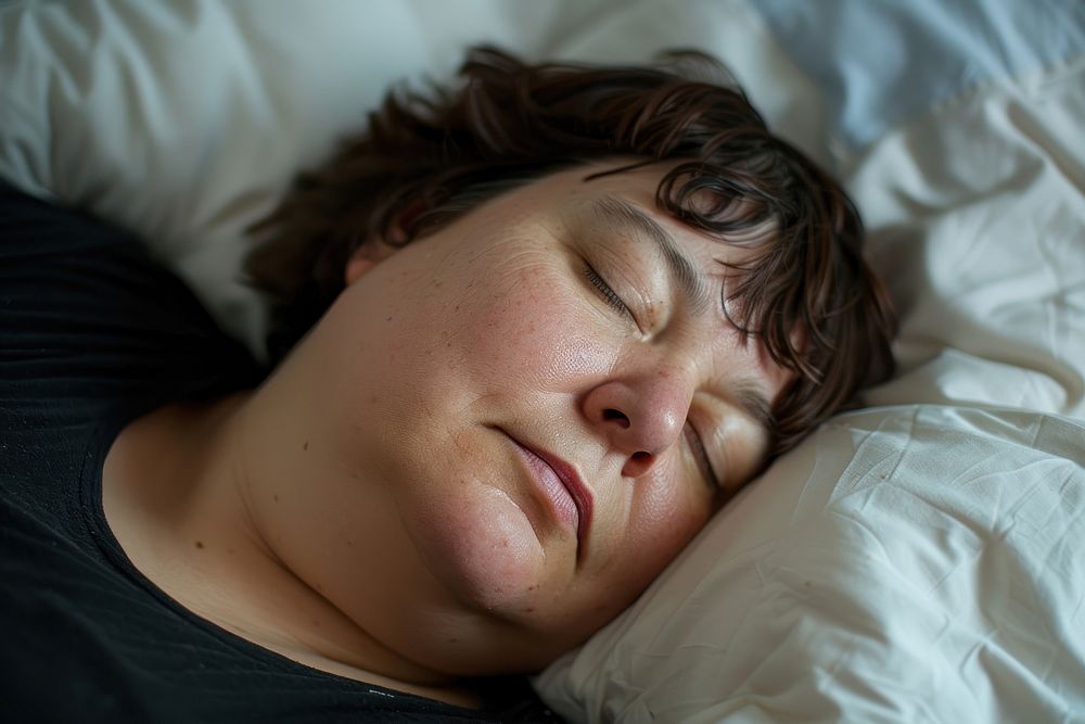 Chubby woman sleep turn to camera side sleeping portrait pillow.