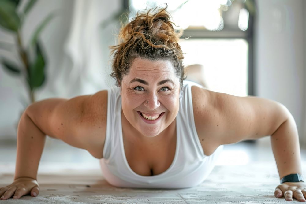 Happy chubby woman doing push up sports determination bodybuilding.