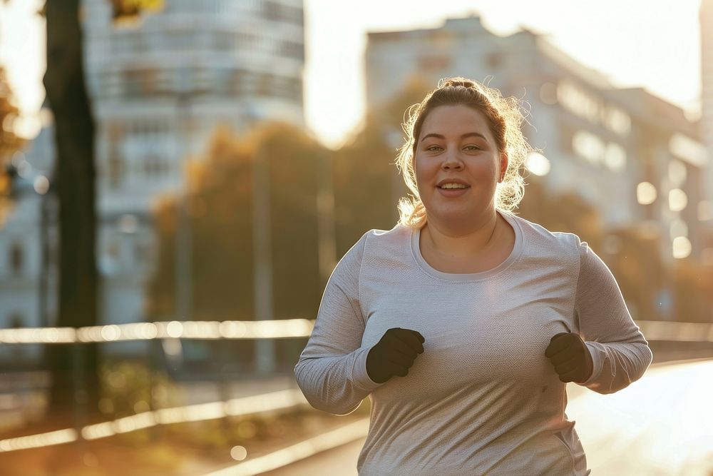 Happy chubby woman jogging in city running adult head.