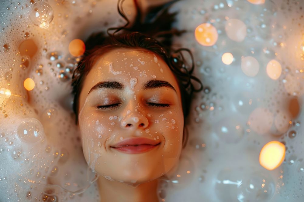 Relaxed woman in bubble bathtub portrait photo celebration.