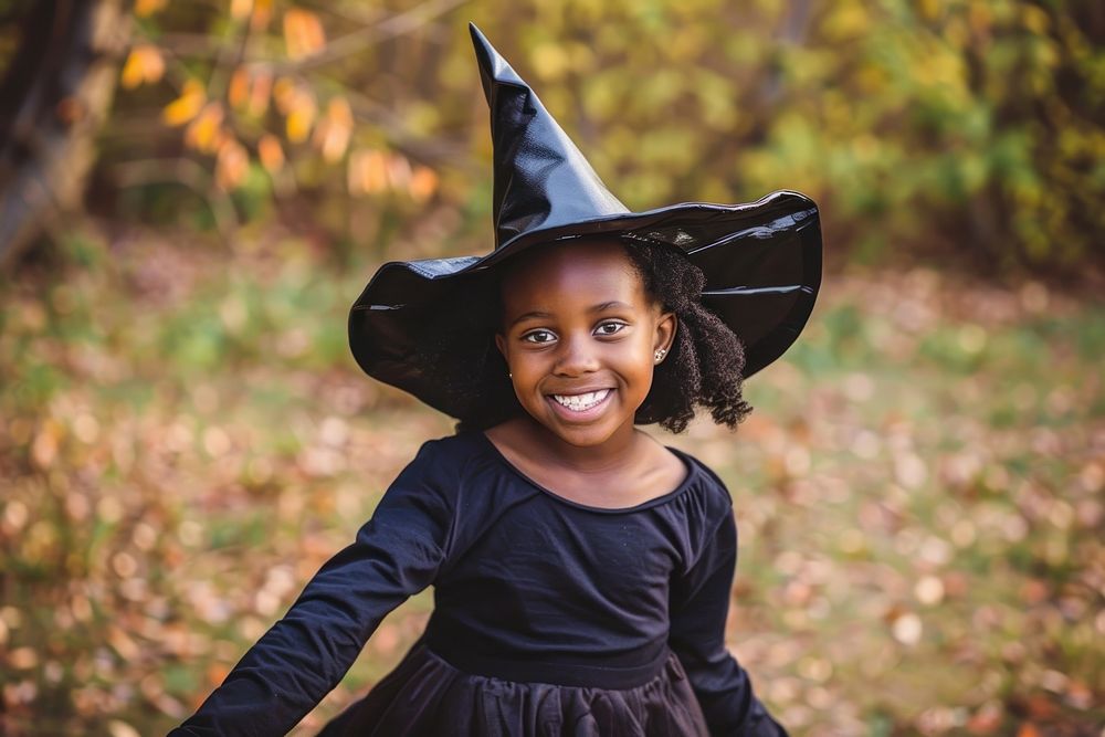 Girl dressed as a witch halloween portrait smile.
