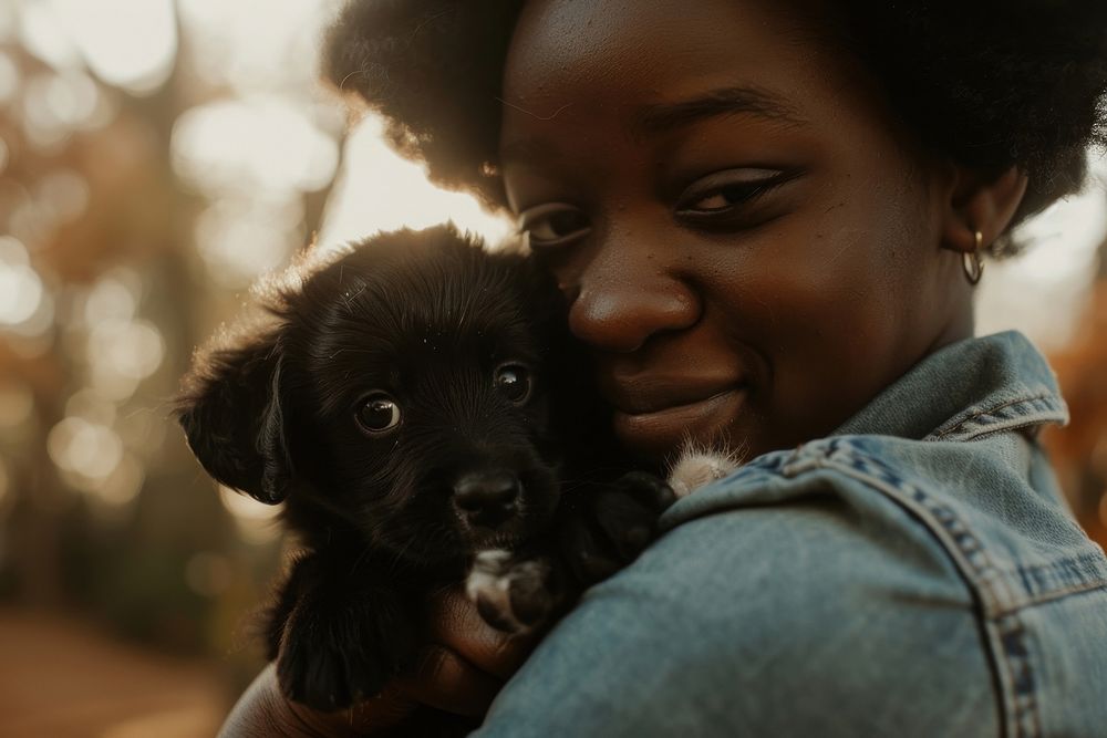 Girl holding a puppy photography portrait mammal.