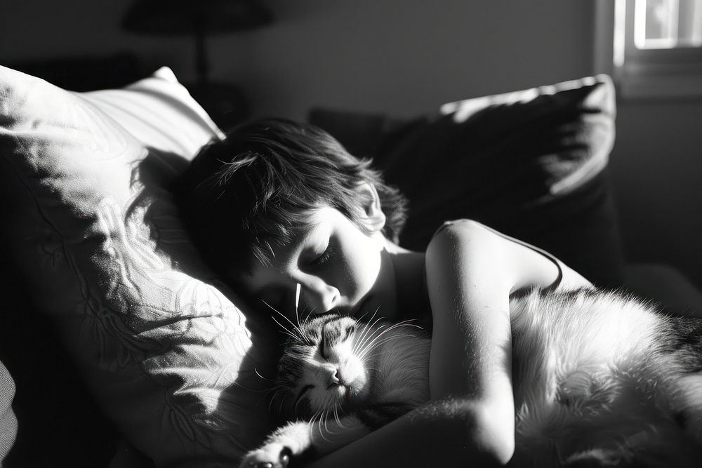 A kid cuddle with a cat furniture sleeping portrait.
