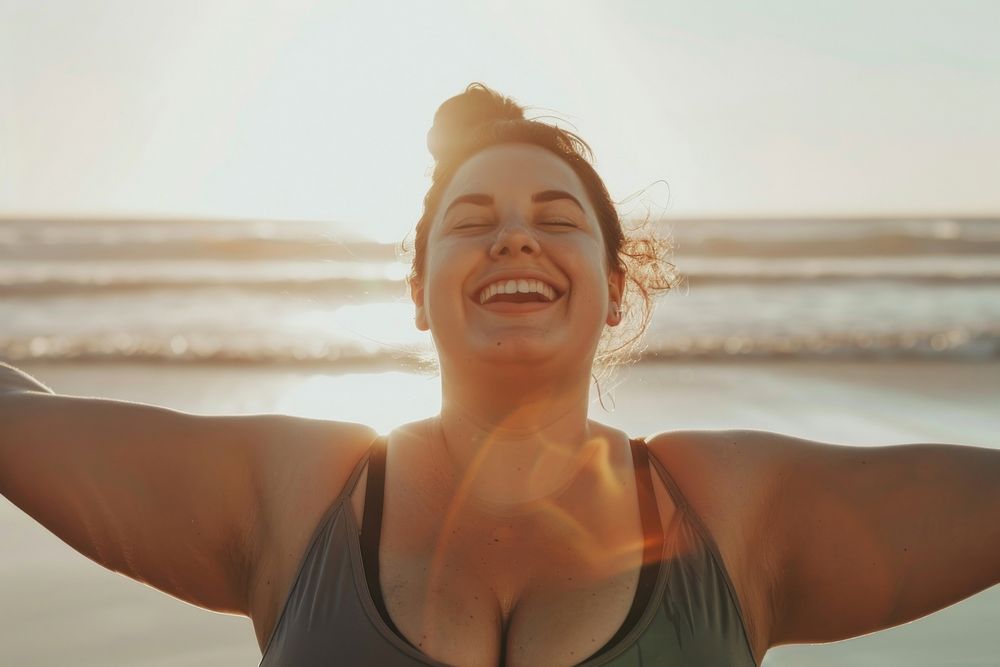 Happy chubby woman workout laughing smile beach.